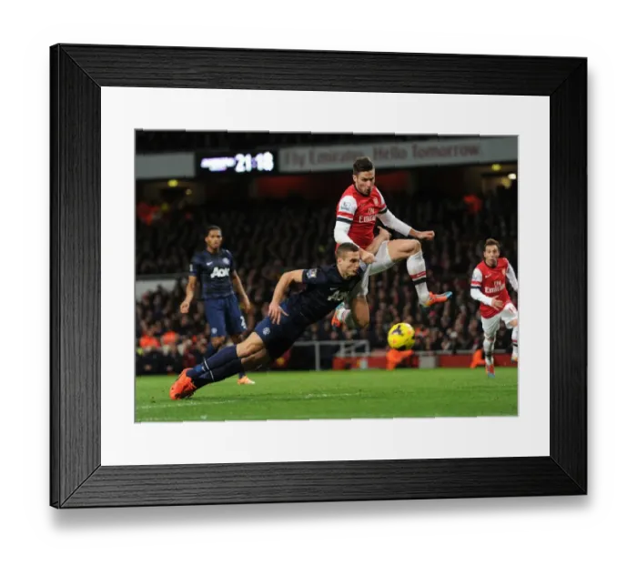 Framed Print : Clash of Titans: Giroud vs. Vidic - Arsenal vs. Manchester United's Battle for Premier League Supremacy (2013-14) - Giroud vs. Vidic: A Rivalry of Power and Skill