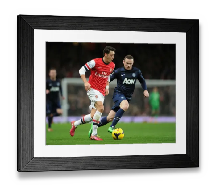 Framed Print : Mesut Ozil Outmaneuvers Wayne Rooney: Arsenal vs Manchester United, Premier League 2013-14