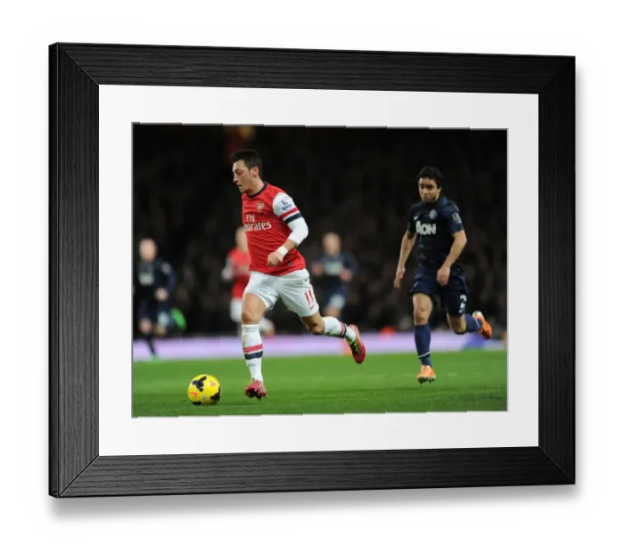 Framed Print : Mesut Ozil vs Rafael: Intense Battle at Arsenal vs Manchester United (2013-14)