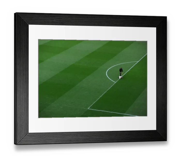 Framed Print : Arsenal Groundsman Prepares Pitch for Arsenal vs Manchester United (2013-14)
