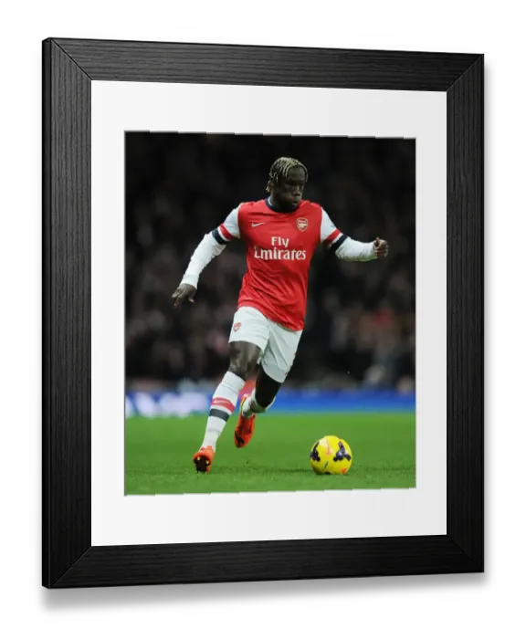 Framed Print : Arsenal's Bacary Sagna in Action Against Manchester United (2013-14) Framed Print : Arsenal's Bacary Sagna in Action Against Manchester United (2013-14)