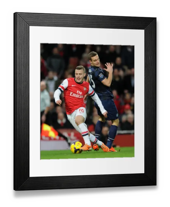 Framed Print : Arsenal's Jack Wilshere Outmaneuvers Manchester United's Nemanja Vidic