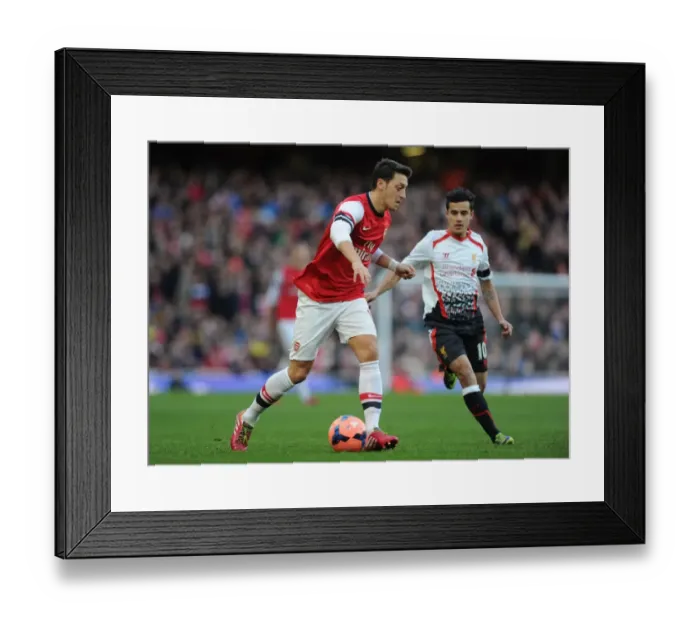 Framed Print : Mesut Ozil vs Philippe Coutinho: Battle at the Emirates - FA Cup 2013-14