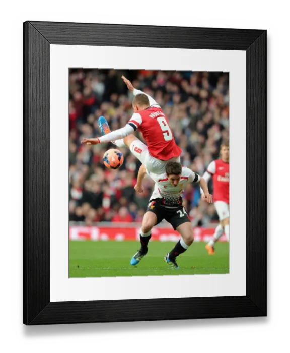 Framed Print : Arsenal vs. Liverpool: Podolski vs. Allen in FA Cup Clash Framed Print : Arsenal vs. Liverpool: Podolski vs. Allen in FA Cup Clash
