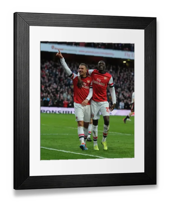Framed Print : Arsenal Celebrate: Podolski and Sanogo Score in FA Cup Fifth Round Against Liverpool Framed Print : Arsenal Celebrate: Podolski and Sanogo Score in FA Cup Fifth Round Against Liverpool