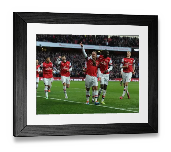 Framed Print : Arsenal Double Strike: Podolski and Sanogo Celebrate Goals Against Liverpool in FA Cup Framed Print : Arsenal Double Strike: Podolski and Sanogo Celebrate Goals Against Liverpool in FA Cup