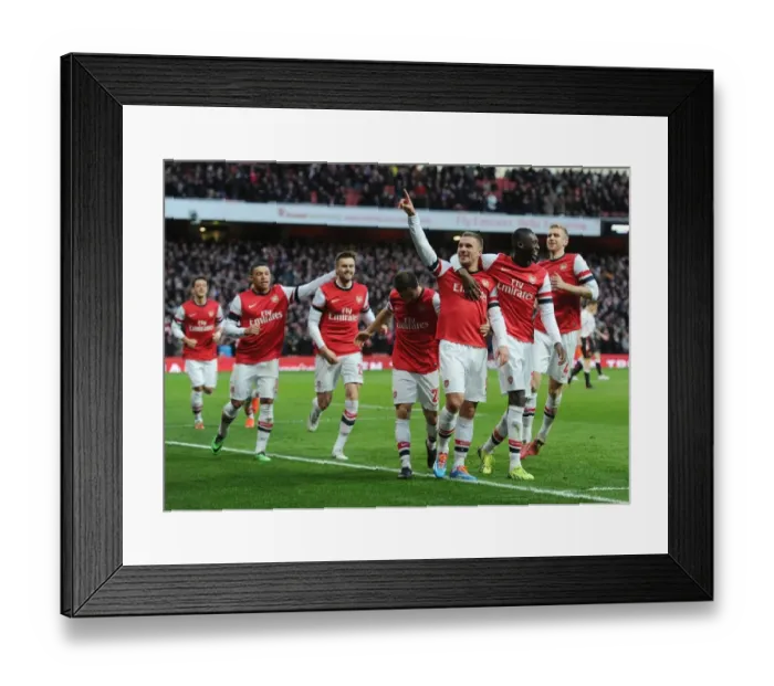 Framed Print : Arsenal Celebrate with Lukas Podolski and Yaya Sanogo: FA Cup Fifth Round vs Liverpool (2013-14) Framed Print : Arsenal Celebrate with Lukas Podolski and Yaya Sanogo: FA Cup Fifth Round vs Liverpool (2013-14)