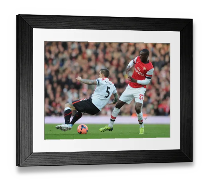 Framed Print : Arsenal vs. Liverpool: Clash in the FA Cup Fifth Round - Yaya Sanogo vs. Daniel Agger