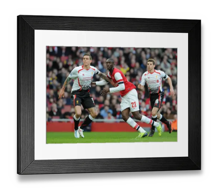 Framed Print : Arsenal vs. Liverpool: Intense Battle Between Yaya Sanogo and Daniel Agger in the FA Cup