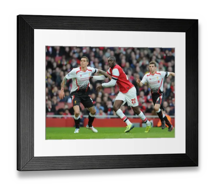 Framed Print : Arsenal vs. Liverpool: Clash of Titans - Sanogo vs. Agger in FA Cup Showdown