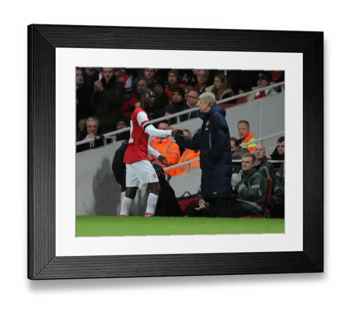 Framed Print : Arsene Wenger the Arsenal Manager shakes hands with Yaya Sanogo (Arsenal) as he comes off as a sub Framed Print : Arsene Wenger the Arsenal Manager shakes hands with Yaya Sanogo (Arsenal) as he comes off as a sub