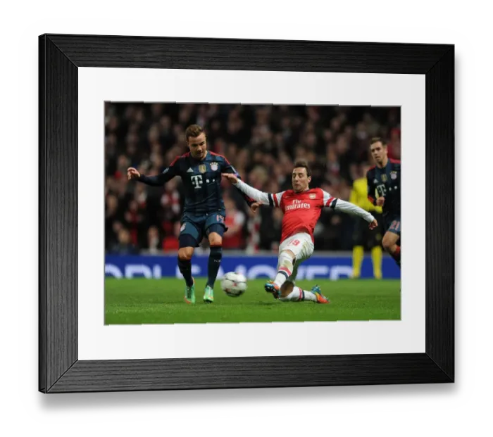 Framed Print : Santi Cazorla vs. Mario Gotze: Arsenal Star Fends Off Bayern's Pressure in Champions League Clash Framed Print : Santi Cazorla vs. Mario Gotze: Arsenal Star Fends Off Bayern's Pressure in Champions League Clash