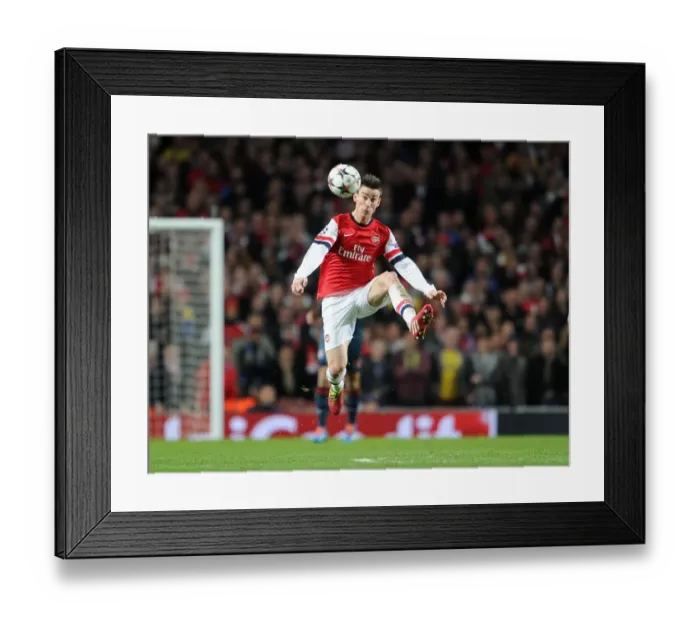 Framed Print : Laurent Koscielny Focuses in Arsenal's Champions League Battle against Bayern Munich