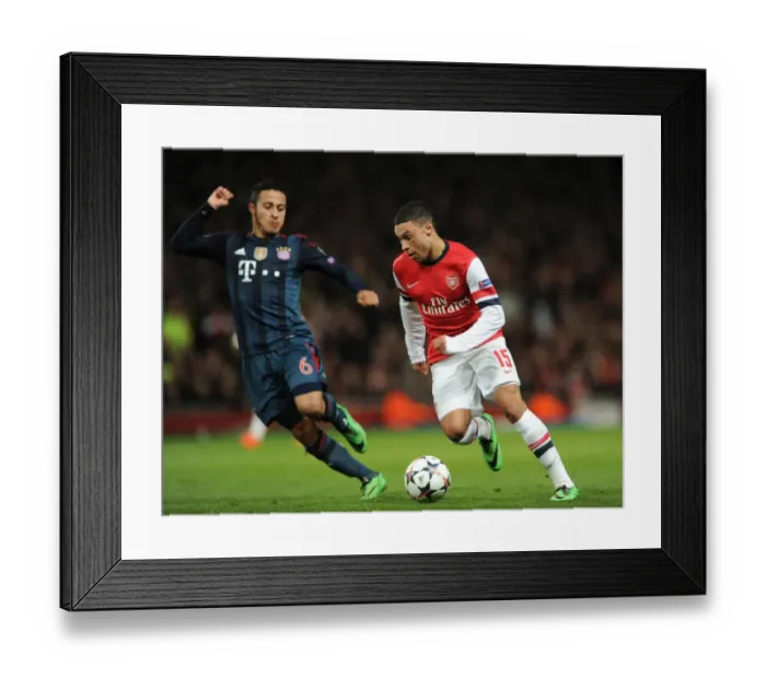 Framed Print : Clash of the Midfield Maestros: Oxlade-Chamberlain vs. Thiago Alcantara - Arsenal vs. Bayern Munich, UEFA Champions League