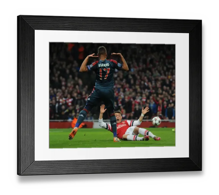 Framed Print : Mesut Ozil vs Jerome Boateng: A Penalty Showdown in the Arsenal vs Bayern Munich UCL Clash Framed Print : Mesut Ozil vs Jerome Boateng: A Penalty Showdown in the Arsenal vs Bayern Munich UCL Clash