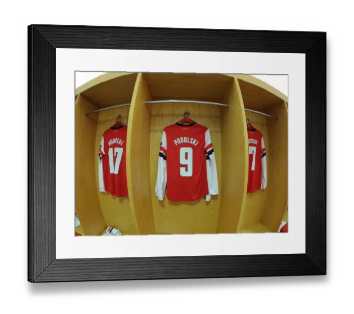 Framed Print : Lukas Podolski's Arsenal Jersey on Display: Arsenal FC vs. FC Bayern Munchen, UEFA Champions League Round of 16 Framed Print : Lukas Podolski's Arsenal Jersey on Display: Arsenal FC vs. FC Bayern Munchen, UEFA Champions League Round of 16