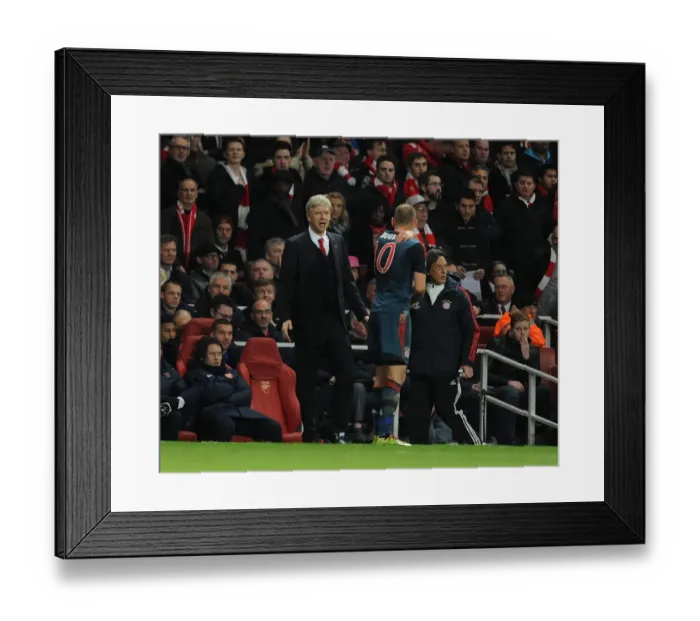 Framed Print : Arsene Wenger and Arjen Robben: A Tense Moment Between Arsenal and Bayern Munich in the UEFA Champions League