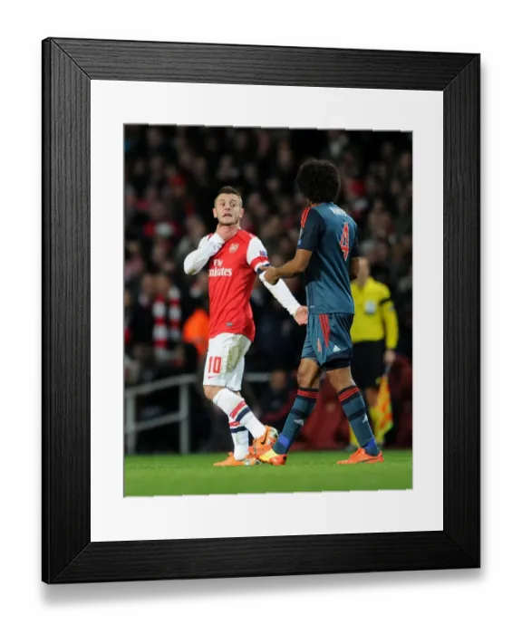 Framed Print : Arsenal's Jack Wilshere Faces Off Against Bayern Munchen's Dante in Champions League Showdown Framed Print : Arsenal's Jack Wilshere Faces Off Against Bayern Munchen's Dante in Champions League Showdown