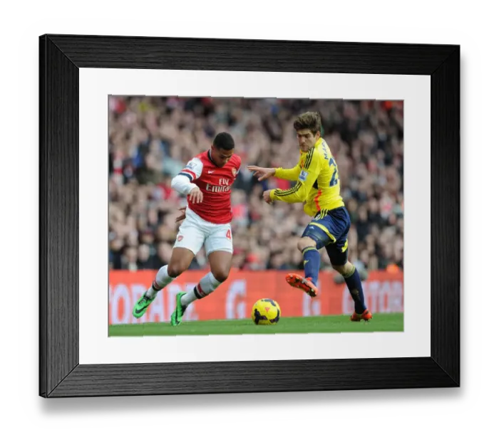 Framed Print : Serge Gnabry vs Marcos Alonso: A Football Rivalry Unfolds at Arsenal (2013-14)