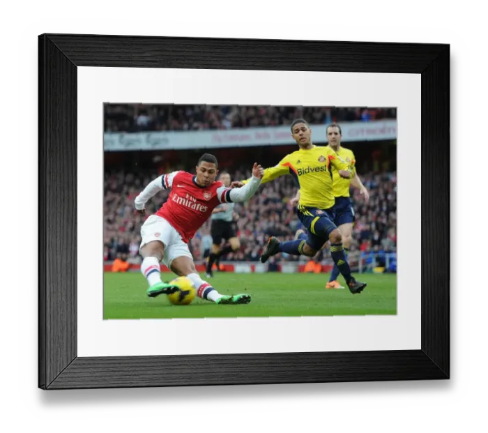 Framed Print : Serge Gnabry vs. Liam Bridcutt: A Premier League Showdown at Emirates Stadium