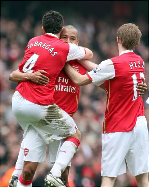 Gilberto celebrates scoring Arsenals 2nd goal with Cesc Fabregas and Alex Hleb