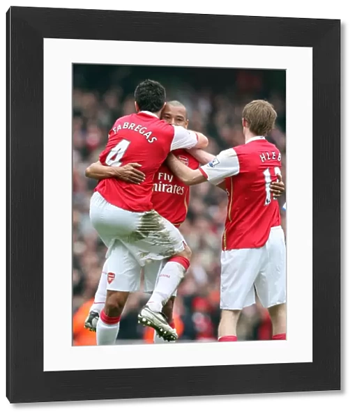 Gilberto celebrates scoring Arsenals 2nd goal with Cesc Fabregas and Alex Hleb