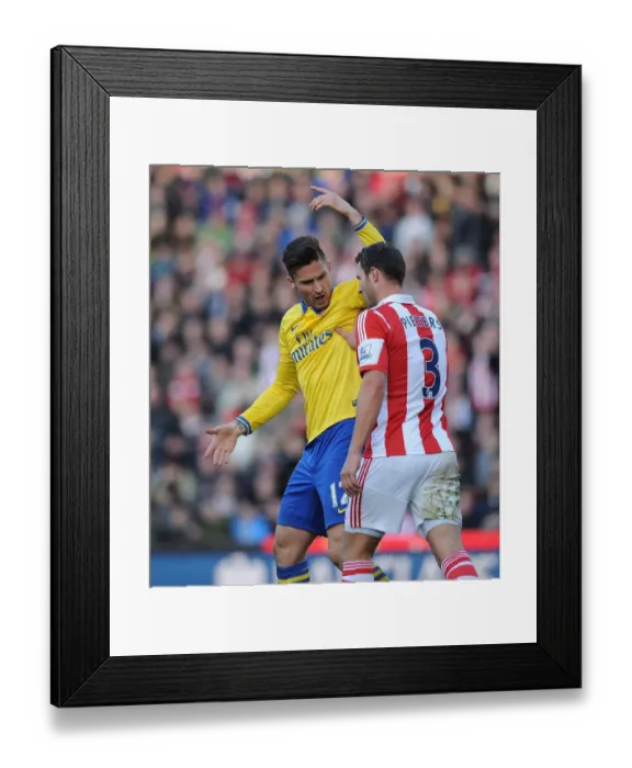 Framed Print : Clash of Titans: Giroud vs Pieters in Stoke City vs Arsenal Premier League Match Framed Print : Clash of Titans: Giroud vs Pieters in Stoke City vs Arsenal Premier League Match