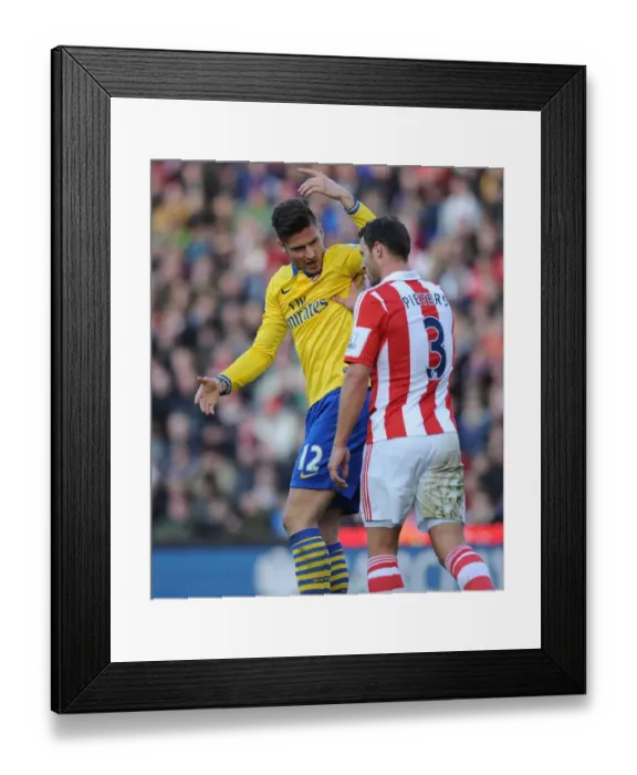 Framed Print : Clash of Titans: Giroud vs Pieters - Arsenal vs Stoke City Premier League Showdown