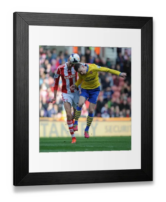 Framed Print : Clash of Titans: Koscielny vs. Crouch - Stoke City vs. Arsenal, Premier League Framed Print : Clash of Titans: Koscielny vs. Crouch - Stoke City vs. Arsenal, Premier League