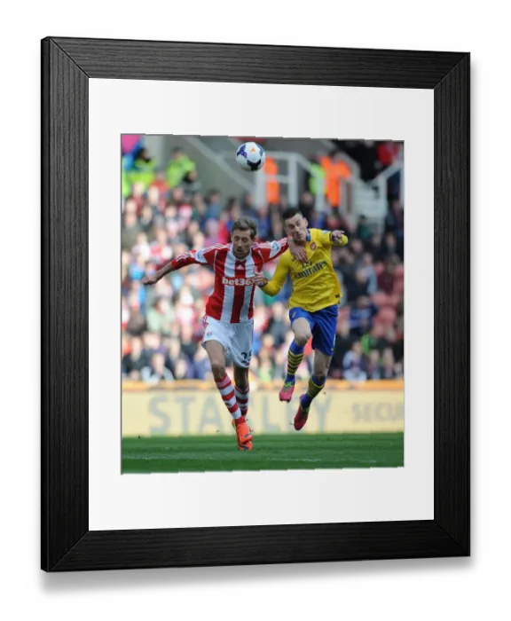 Framed Print : Clash of Titans: Koscielny vs. Crouch - A Premier League Battle (Stoke City vs. Arsenal 2013-14) Framed Print : Clash of Titans: Koscielny vs. Crouch - A Premier League Battle (Stoke City vs. Arsenal 2013-14)