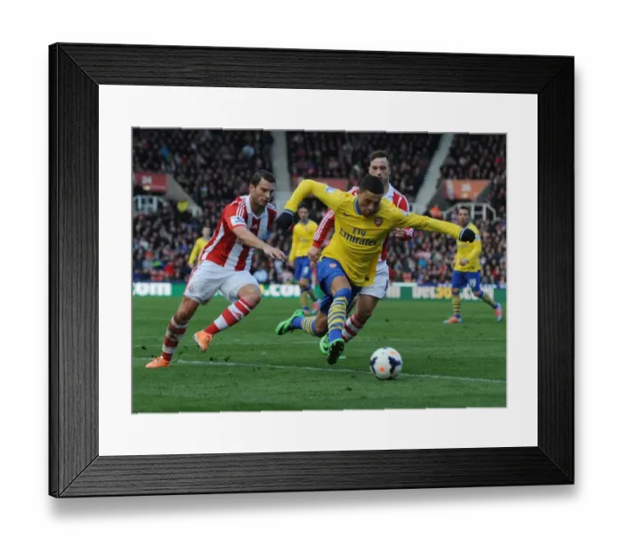 Framed Print : Arsenal's Oxlade-Chamberlain Breezes Past Stoke's Peiters and Arnautovic