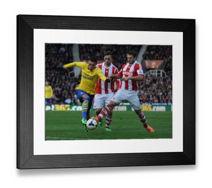 Framed Print : Arsenal's Oxlade-Chamberlain Brakes Past Stoke's Peiters and Arnautovic Framed Print : Arsenal's Oxlade-Chamberlain Brakes Past Stoke's Peiters and Arnautovic