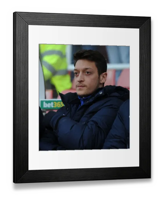Framed Print : Mesut Ozil: Ready to Sub in for Arsenal against Stoke City (2013-14)