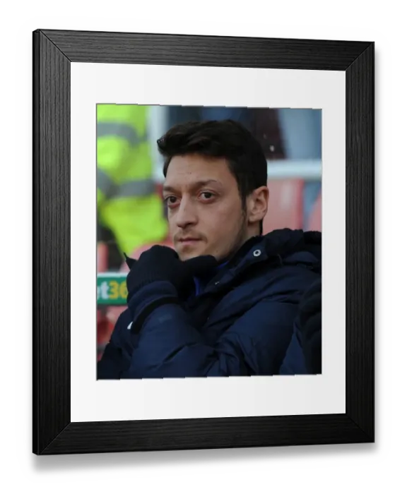 Framed Print : Mesut Ozil: Ready to Sub in for Arsenal against Stoke City (2014)