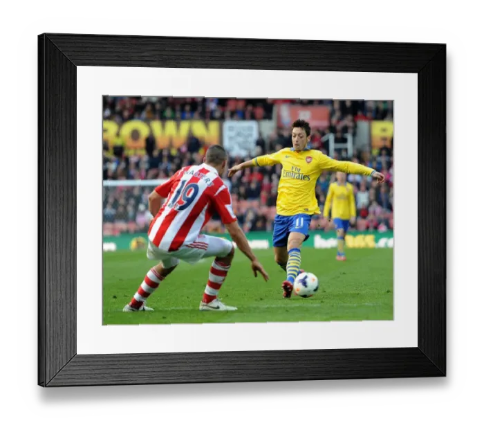 Framed Print : Mesut Ozil vs. Jonathan Walters: Clash at Britannia Stadium - Stoke City vs. Arsenal, Premier League 2013-14