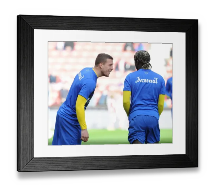 Framed Print : Lukas Podolski and Bacary Sagna (Arsenal). Stoke City 1: 0 Arsenal. Barclays Premier League