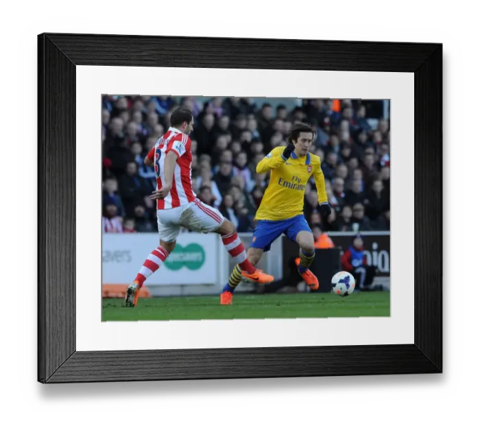 Framed Print : Tomas Rosicky Outmaneuvers Erik Pieters: A Moment from the Stoke City vs. Arsenal Premier League Clash