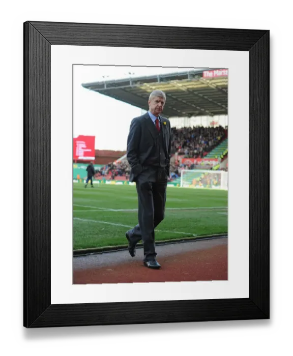 Framed Print : Arsene Wenger: Unwavering Determination Before Stoke City Match (2014) Framed Print : Arsene Wenger: Unwavering Determination Before Stoke City Match (2014)