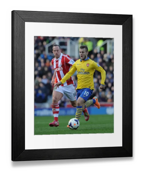 Framed Print : Jack Wilshere vs. Charlie Adam: Midfield Showdown in Arsenal vs. Stoke City Premier League Clash (2013-14)