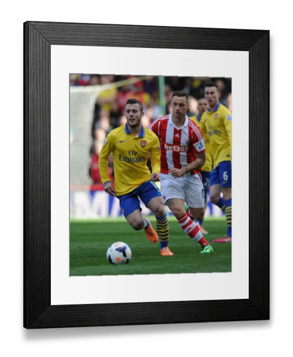 Framed Print : Jack Wilshere vs Marko Arnautovic: Battle in the Midfield - Stoke City vs Arsenal, Premier League 2013-14