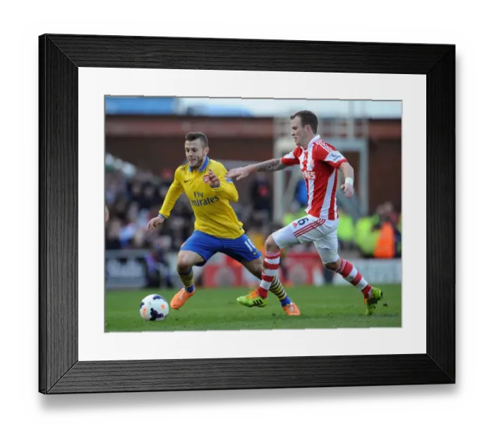 Framed Print : Jack Wilshere vs. Glenn Whelan: Battle in the Midfield - Stoke City vs. Arsenal, Premier League 2013-14 Framed Print : Jack Wilshere vs. Glenn Whelan: Battle in the Midfield - Stoke City vs. Arsenal, Premier League 2013-14