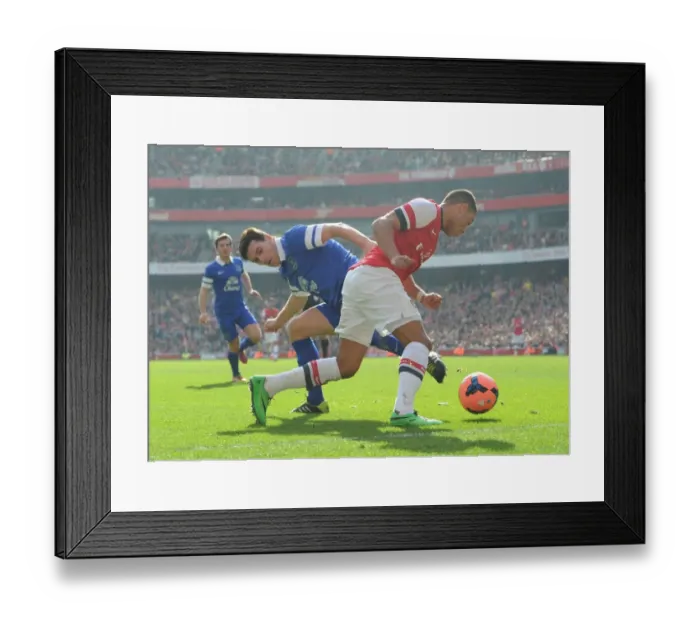Framed Print : Arsenal's Oxlade-Chamberlain Fouled by Everton's Barry in FA Cup Quarters Framed Print : Arsenal's Oxlade-Chamberlain Fouled by Everton's Barry in FA Cup Quarters