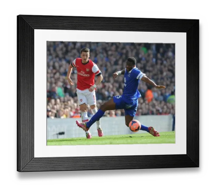 Framed Print : Arsenal vs. Everton: Ozil Evades Distin in FA Cup Quarter-Final Showdown