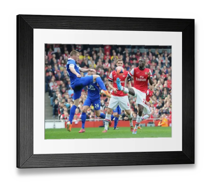 Framed Print : Arsenal's Yaya Sanogo Faces Off Against Everton's James McCarthy in FA Cup Quarter-Final Showdown Framed Print : Arsenal's Yaya Sanogo Faces Off Against Everton's James McCarthy in FA Cup Quarter-Final Showdown