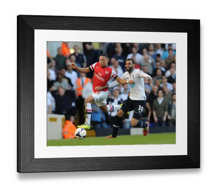 Framed Print : Arsenal's Alex Oxlade-Chamberlain Faces Off Against Tottenham's Sandro in Premier League Clash