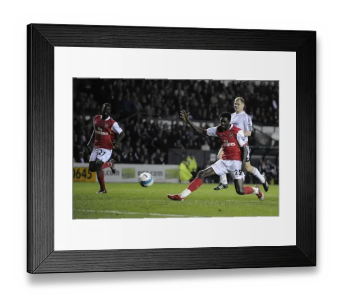 Framed Print : Emmanuel Adebayor shoots past Derby goalkeeper Roy Carroll to score his 2nd Framed Print : Emmanuel Adebayor shoots past Derby goalkeeper Roy Carroll to score his 2nd