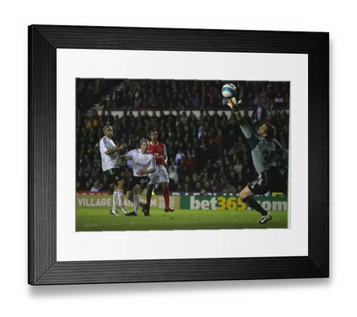 Framed Print : Theo Walcott shoots past Derby goalkeeper Roy Carroll to score the 4th Arsenal goal