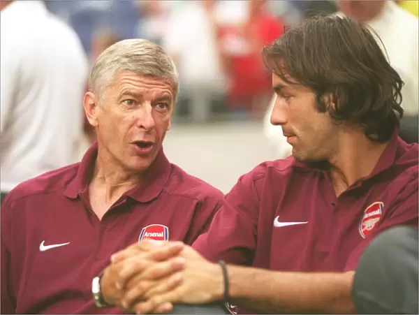 Arsene Wenger the Arsenal Manager with Robert Pires. Ajax 0: 1 Arsenal