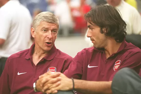 Arsene Wenger the Arsenal Manager with Robert Pires. Ajax 0: 1 Arsenal