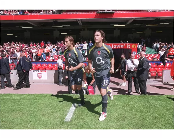 Cesc Fabregas and Mathieu Flamini (Arsenal) run out to warm up